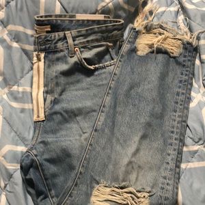 Distressed imperfectly perfect jeans